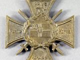 an image of a medal with a cross on it on a white surface
