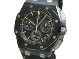an image of a black and yellow watch on a white background