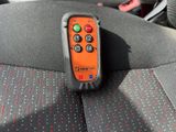 a remote control sitting on the seat of a car