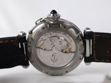 a close up of a watch on a white surface