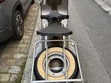 a scooter parked on the side of the street
