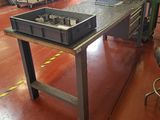 an image of a workbench in a factory with a lot of tools