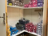 a closet filled with lots of different colored items