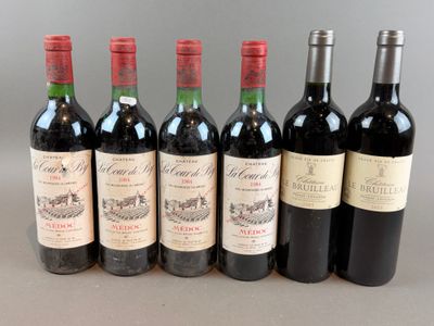 six bottles of red wine lined up in a row on a table