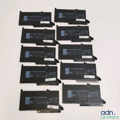 a lot of laptop batteries that are laying on the table