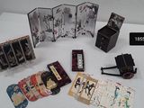 a lot of cards and a camera on a table