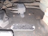 a close up of a car ' s engine with a plaque on it