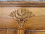 a close up of a wooden door with a clock on it