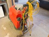 a machine that is sitting on the floor in the garage