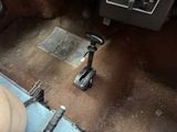 a close up of a car ' s floor with a steering wheel