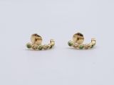 a pair of gold earrings with green and white stones