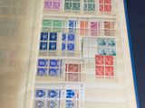 a book with stamps on it sitting on a table