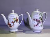 three teapots sitting next to each other on a table