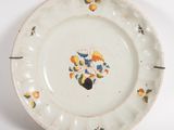 a white plate with a design of oranges on it