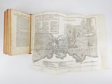 an open book with a map of europe on it sitting on a table