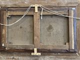 a picture of an old window with a rope hanging from it