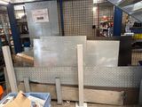 many boxes and boxes in a room with a metal wall