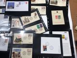 a lot of stamps on a table with a picture on it