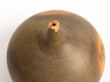 an image of a brown vase on a white surface