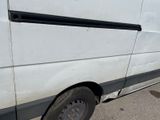 a white van that is parked in the parking lot