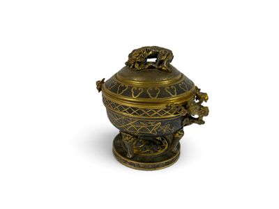 a gold and black urn with a dragon on it
