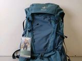 the back of a blue backpack with a picture of a dog on it