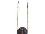a black round bag with a red and green stripe on the front