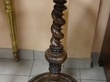 a small table that is on the floor next to a chair