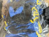 a bag of gloves and a pair of gloves on a table