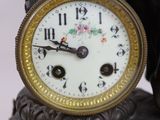 a clock that is sitting on top of a table
