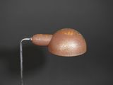 a small brown object on a metal stick