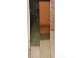 an image of a tall silver vase sitting on top of a table
