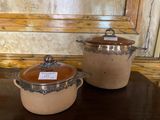 two pots that are sitting on a table