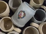many cups of coffee in a basket on the table
