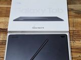 the box is open on the table with the tablet in it