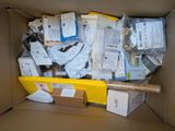 a cardboard box filled with many different types of electronic equipment