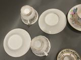 four cups and saucers sitting on a table