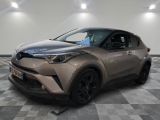 the toyota c - hr suv is parked in a showroom