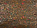 a painting on the wall of a room with birds and flowers