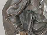 statue of a man with a book in his hands