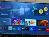 a flat screen tv sitting on top of a table