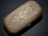 a close up of a small case with a cross on it