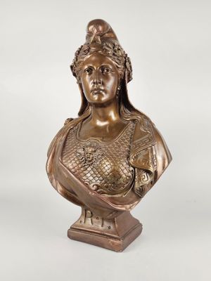 a bronze busturine of a woman with a crown on her head