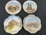 three plates with different designs on them sitting on a table
