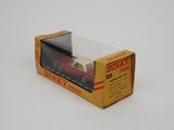 an open box with a toy car inside of it on a white surface