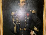portrait of a man in a military uniform in a gold frame