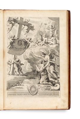 un vieux livre sur lequel figure un dessin représentant des anges et des démons