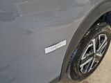 a close up of a car tire with a sticker on it