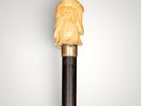 an image of a wooden stick with a carved head on it