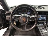 the interior of a porsche sports car with a steering wheel and dashboard